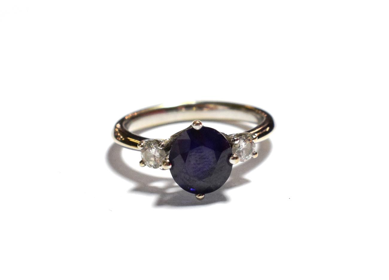 Lot 190 - A sapphire and diamond three stone ring, unmarked, finger size K1/2