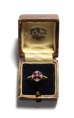 Lot 196 - A 9 carat gold ruby and diamond cluster ring, finger size P