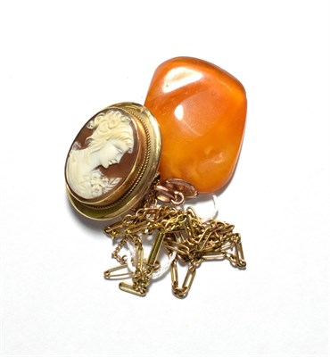 Lot 200 - A butterscotch amber pendant, with mount stamped '9CT' and fiagaro link chain with applied...