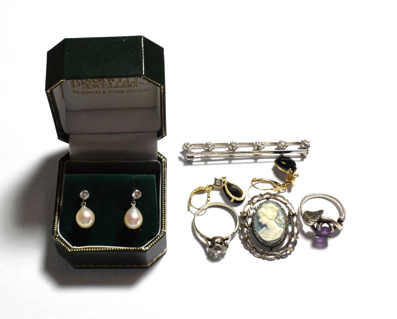 Lot 201 - A pair of 18 carat white gold diamond and cultured pearl drop earrings; two dress rings,...