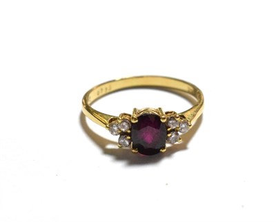 Lot 206 - A ruby and diamond ring, stamped '750', finger size J1/2
