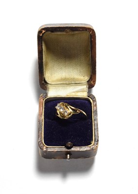 Lot 207 - A 9 carat gold diamond three stone ring, three round brilliant cut diamonds in yellow claw...