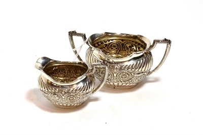 Lot 218 - A Victorian silver cream-jug and sugar bowl, by John Round & Son Ltd, Sheffield 1886 and 1891, each