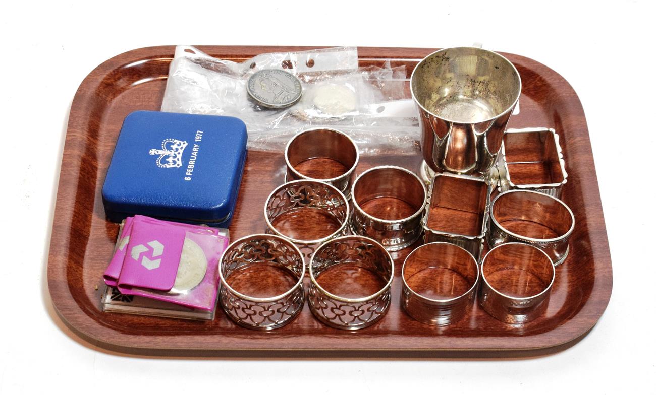 Lot 232 A pair of silver napkinrings and three