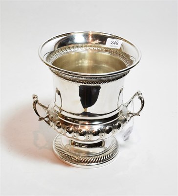 Lot 248 - A silver-plated wine-cooler, 19th century, cylindrical and on spreading gadrooned foot, the...