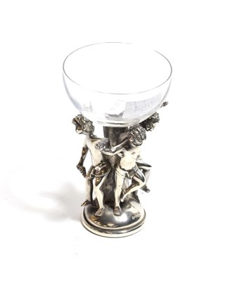 Lot 254 - An Italian white metal and glass Bacchic wine glass by Ottaviani, the bowl supported on figural...