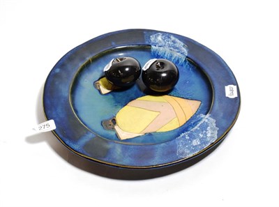 Lot 275 - A Studio pottery dish decorated with boats, together with two black marble apples