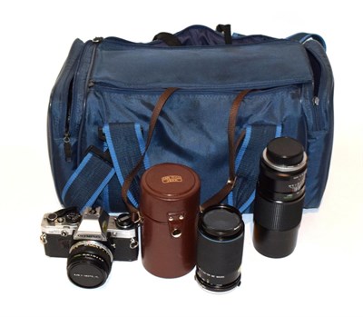 Lot 277 - Olympus OM10 Camera and lenses: 50mm, 28mm, 70-210mm and 300mm; and a flash gun