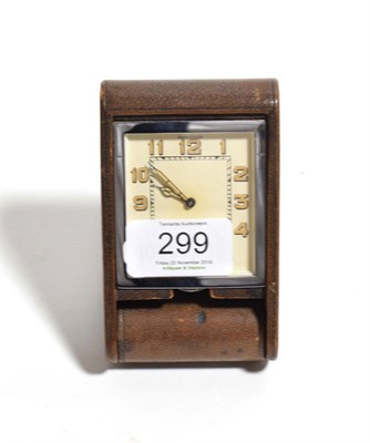 Lot 299 - An Art Deco Jaeger-LeCoultre travel clock, Arabic dial, leather folding case, 11cm high