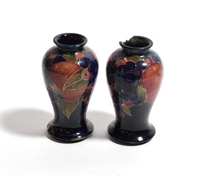 Lot 300 - A pair of William Moorcroft miniature Pomegranate vases (damaged)