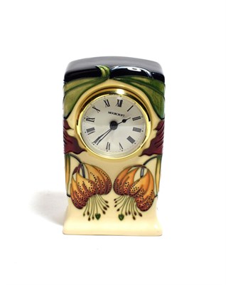 Lot 301 - A Moorcroft clock, signed and dated 98, boxed, 16cm high