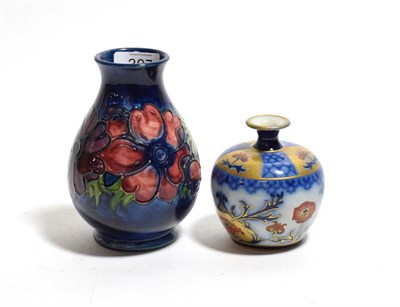 Lot 307 - A Macintyre Aurelian ware bottle vase, stamped to base, Rd No. 314901, 9cm height; together...