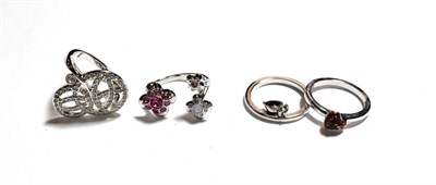 Lot 341 - Four Swarovski dress rings, of varying designs and sizes