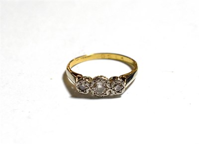 Lot 343 - A diamond three stone ring, finger size O