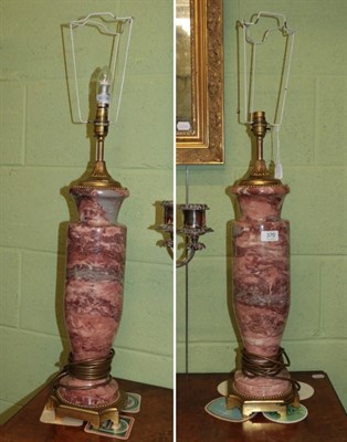 Lot 370 - A pair of pink marble lamps, 65cm high