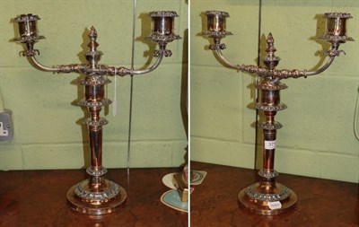 Lot 371 - A pair of silver-plated two-light candelabra, 19th century, each on circular base with foliage...