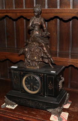 Lot 373 - A Victorian black slate striking mantel clock, case surmounted by a bronzed spelter figure of a...
