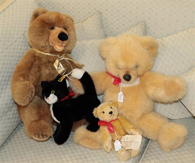 Lot 376 - Four modern Steiff soft toys, comprising two large Teddy bears, a smaller jointed Teddy bear...