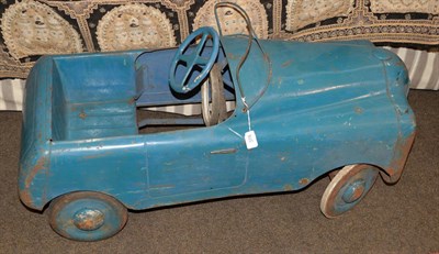 Lot 378 - A 1930's pressed steel and metal pedal car, with blue painted body, open wind shield and four-spoke