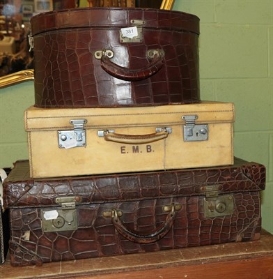 Lot 381 - Pigskin leather suitcase stamped E.M.B, a brown crocodile fitted case and a brown leather...