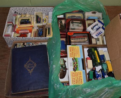 Lot 393 - Postcard album together with various modern Diecast and Rupert annuals (two boxes)