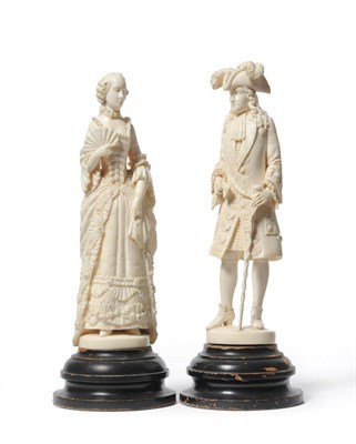 Lot 964 - A Pair of Dieppe Ivory Court Figures, late 19th century, he standing wearing a feathered...