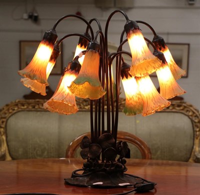 Lot 416 - An Art Nouveau style twelve branch table lamp