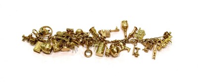 Lot 425 - A 9 carat gold fancy link charm bracelet hung with various charms including a horse, an acorn,...