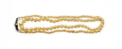 Lot 431 - A graduated cultured pearl necklace with a marcasite set clasp, length 52cm