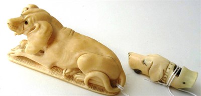 Lot 968 - A Carved Ivory Walking Stick Handle, 19th century, as a recumbent hound with glass eyes, 11cm long