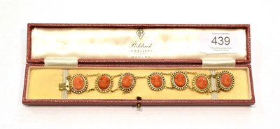 Lot 439 - A coral plaque bracelet, length 17.5cm