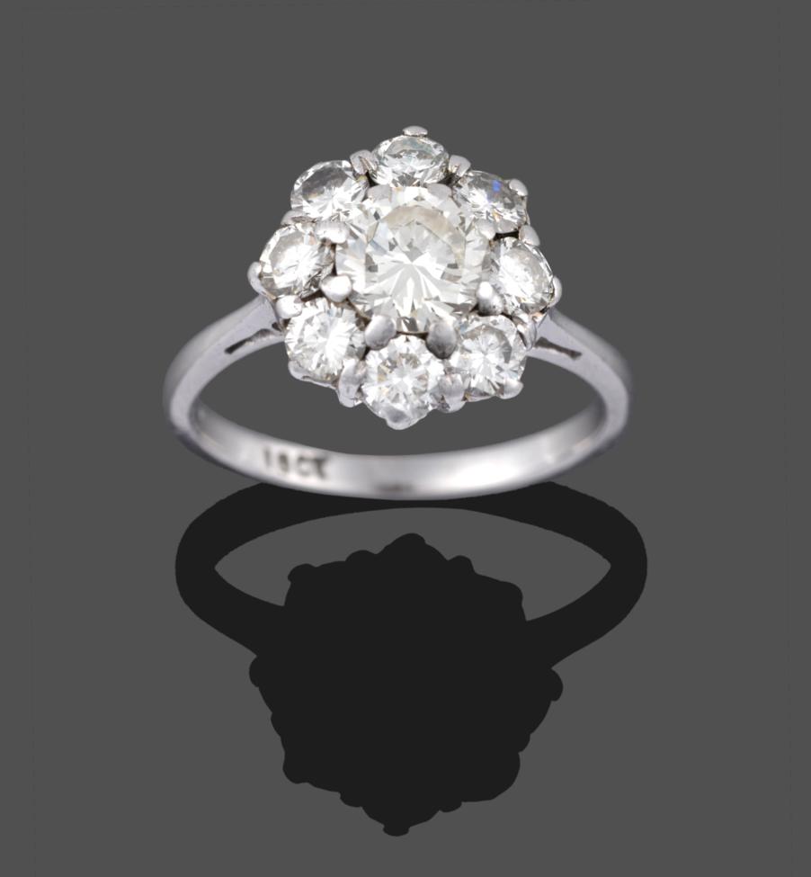 Lot 2008 - A Diamond Cluster Ring, a round brilliant cut diamond within a border of eight smaller round...