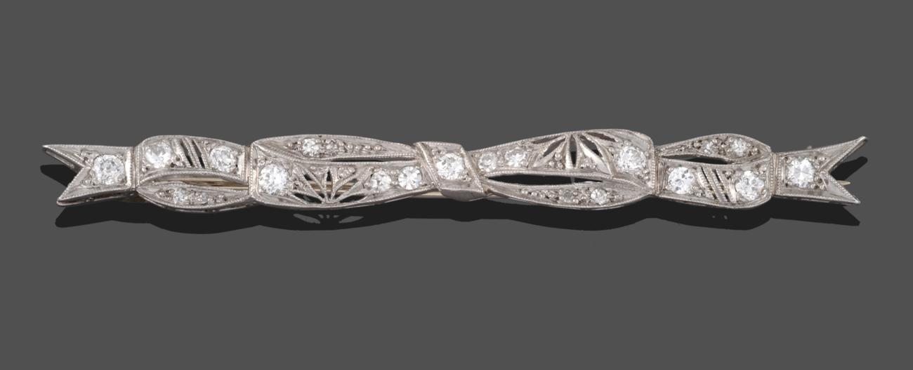 Lot 2013 - An Art Deco Diamond Bow Brooch, the bow form with pierced detail and set throughout with old...