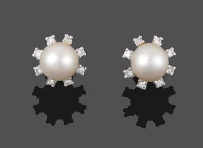 Lot 2026 - A Pair of 18 Carat White Gold Cultured Pearl and Diamond Cluster Earrings, a cultured pearl...