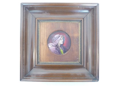 Lot 974 - A Limoges Enamel Circular Plaque, by Paul Bonnaud, circa 1900, as a bust portrait of a girl wearing