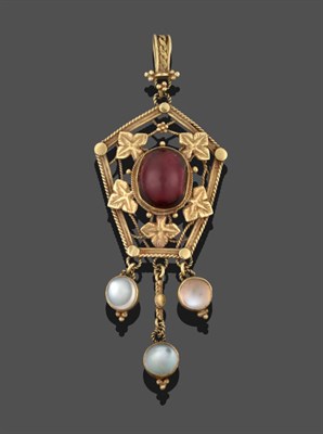 Lot 2052 - An Arts & Crafts Style Garnet and Moonstone Pendant, a fancy yellow bale suspends an oval...