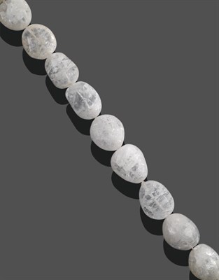 Lot 2056 - A Rock Crystal Necklace, by Charmian Ottaway, eleven large irregular rock crystal beads, length...