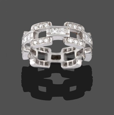 Lot 2061 - A Diamond Eternity Ring, of open brick link design, the square links with trios of round...