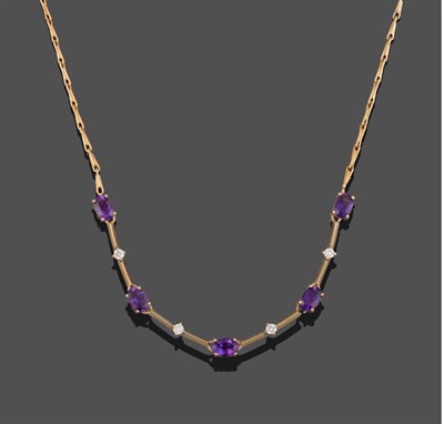 Lot 2073 - A 9 Carat Gold Amethyst and Diamond Necklace, five oval cut amethysts alternate with four round...
