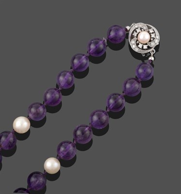 Lot 2080 - An Amethyst and Cultured Pearl Necklace, the round amethyst beads spaced by cultured pearls knotted
