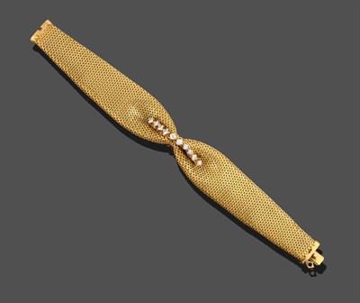 Lot 2090 - A Diamond Bracelet, the broad yellow bracelet of mesh links gathered centrally into a bow...