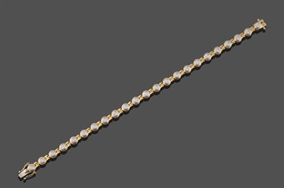 Lot 2107 - An 18 Carat Gold Diamond Bracelet, the round brilliant cut diamonds in white rubbed over...