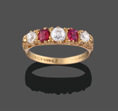 Lot 2110 - An 18 Carat Gold Ruby and Diamond Five Stone Ring, three graduated old cut diamonds alternate...