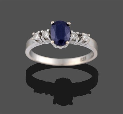Lot 2122 - A Sapphire and Diamond Five Stone Ring, the central oval cut sapphire flanked by two round...