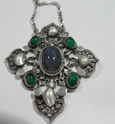 Lot 2129 - An Arts and Crafts Style Necklace, an oval cabochon blue stone in a white collet setting, to a...