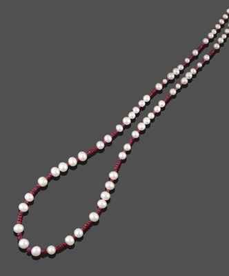 Lot 2143 - A Ruby and Cultured Pearl Necklace, faceted ruby roundel beads spaced by groups of cultured pearls