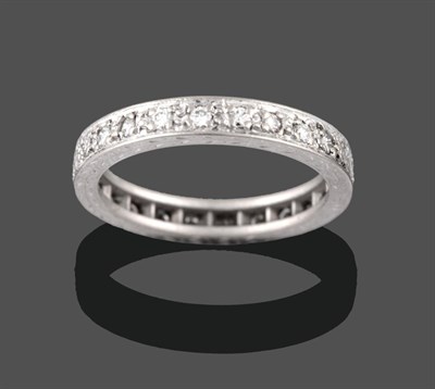 Lot 2148 - An 18 Carat White Gold Diamond Eternity Ring, the round brilliant cut diamonds in claw...