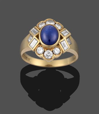 Lot 2158 - An 18 Carat Gold Sapphire and Diamond Ring, the oval cabochon sapphire in a yellow rubbed over...