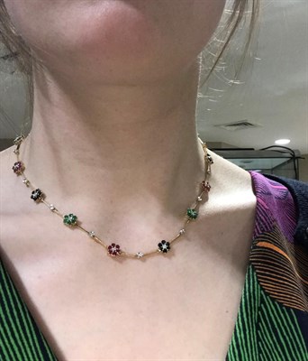 Lot 2179 - A Diamond, Emerald, Ruby and Sapphire Necklace, comprising of alternating emerald, ruby and...