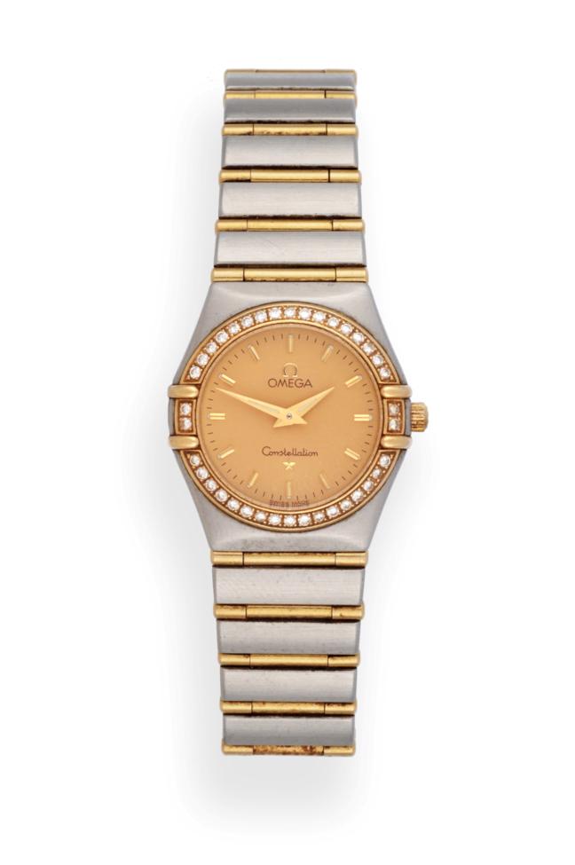 Lot 2211 - A Lady's Steel and Gold Diamond Set Wristwatch, signed Omega, model: Constellation, circa 2000,...